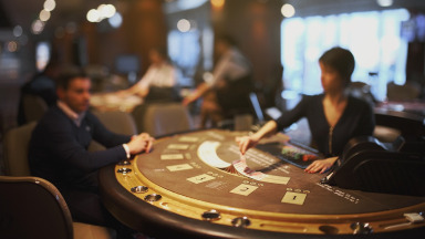 AE Casino blackjack dealer and casino chips